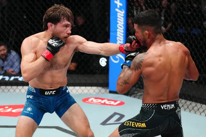 LAS VEGAS, NEVADA - APRIL 04: (L-R) Ethyn Ewing punches Rafael Estevam of Brazil in a bantamweight fight during the UFC Fight Night event at Meta APEX on April 04, 2026 in Las Vegas, Nevada. (Photo by Jeff Bottari/Zuffa LLC)