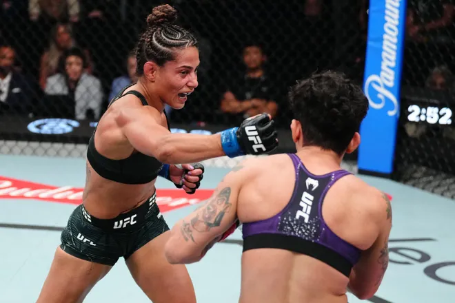 LAS VEGAS, NEVADA - APRIL 04: (L-R) Tabatha Ricci of Brazil punches Virna Jandiroba of Brazil in a strawweight fight during the UFC Fight Night event at Meta APEX on April 04, 2026 in Las Vegas, Nevada. (Photo by Jeff Bottari/Zuffa LLC)