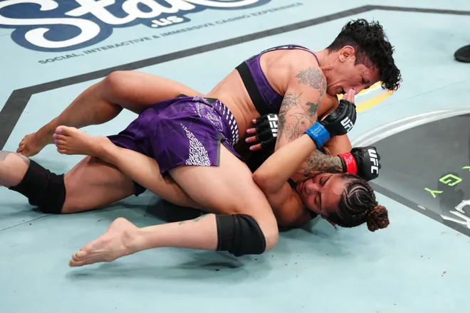 LAS VEGAS, NEVADA - APRIL 04: (L-R) Virna Jandiroba of Brazil elbows Tabatha Ricci of Brazil in a strawweight fight during the UFC Fight Night event at Meta APEX on April 04, 2026 in Las Vegas, Nevada. (Photo by Jeff Bottari/Zuffa LLC)