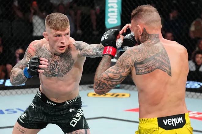 LAS VEGAS, NEVADA - APRIL 04: (L-R) Opponents Chris Duncan of Scotland punches Renato Moicano of Brazil in a lightweight fight during the UFC Fight Night event at Meta APEX on April 04, 2026 in Las Vegas, Nevada. (Photo by Jeff Bottari/Zuffa LLC)