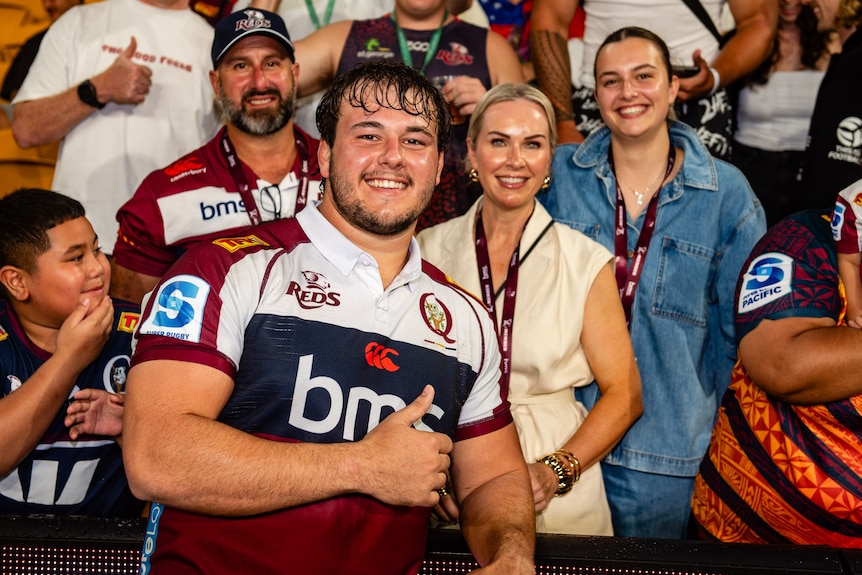 Massimo De Lutiis with spectators at Lang Park after a Reds match.
