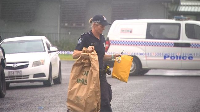 Police outside the home where a woman was located deceased, sparking a homicide investigation.