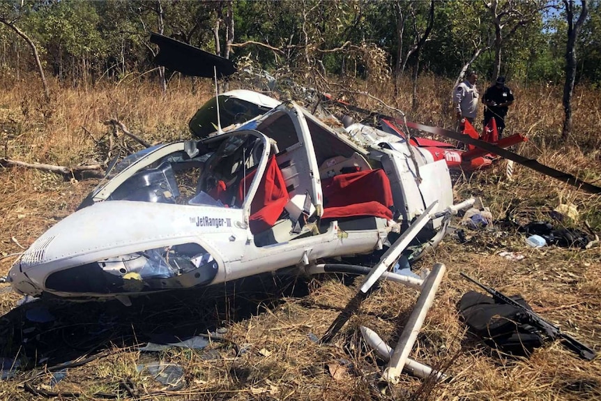 A photo of a helicopter wreckage in remote terrain in Kakadu National Park.