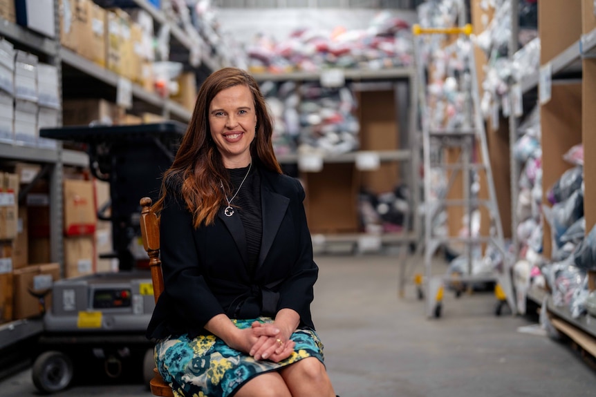 A woman smiles for a photo