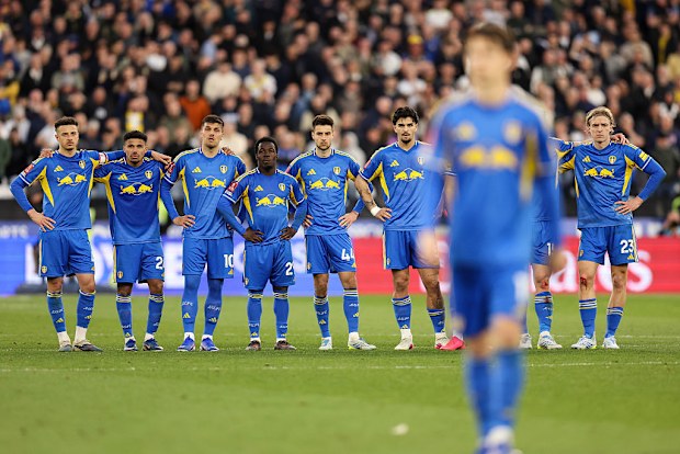 The Leeds team watch on during the penalty shootout.