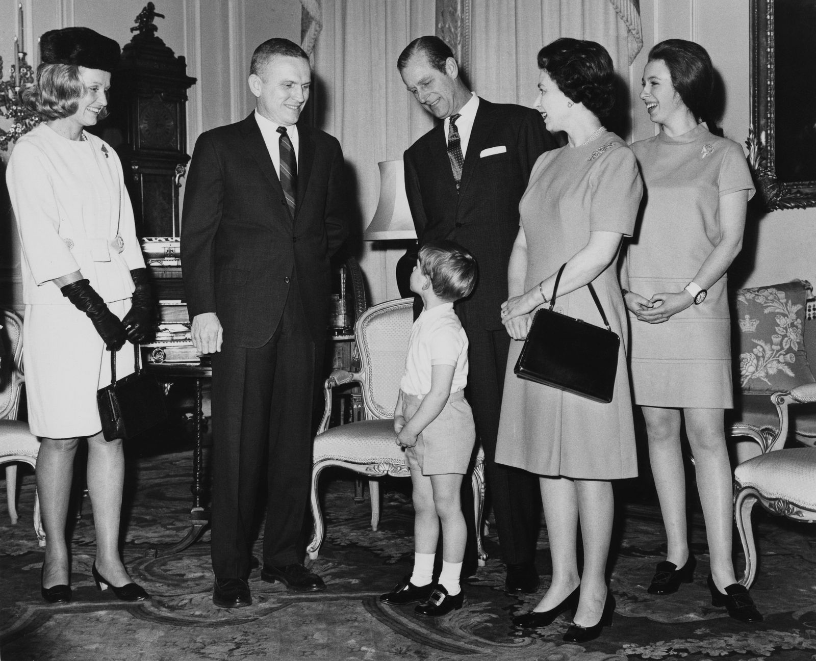 Image may contain Philip Tomalin Elizabeth II Clothing Formal Wear Suit Accessories Bag Handbag Person and Adult