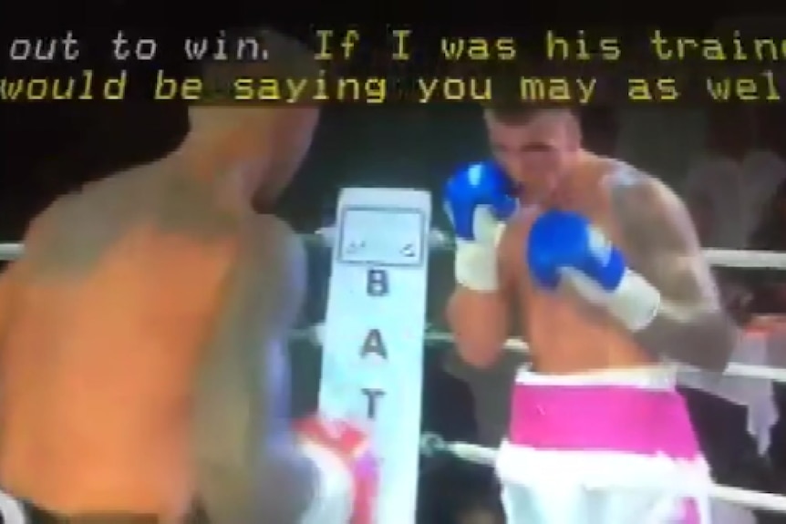 A screengrab of a boxing match, low quality.