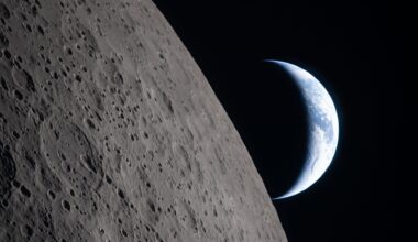 A view of Earth from the moon, with half the Earth illuminated and the gray surface of the moon in the foreground.