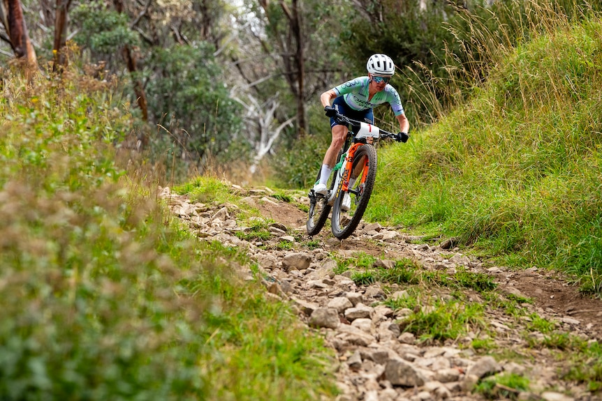 Bec Henderson rides a mountain bike