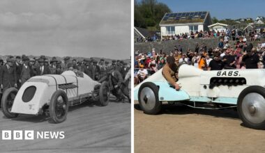 A general view of the car 'Babs' with a crowd of spectators behind it. It is white and light blue with 'Babs' written on the side in large letters.