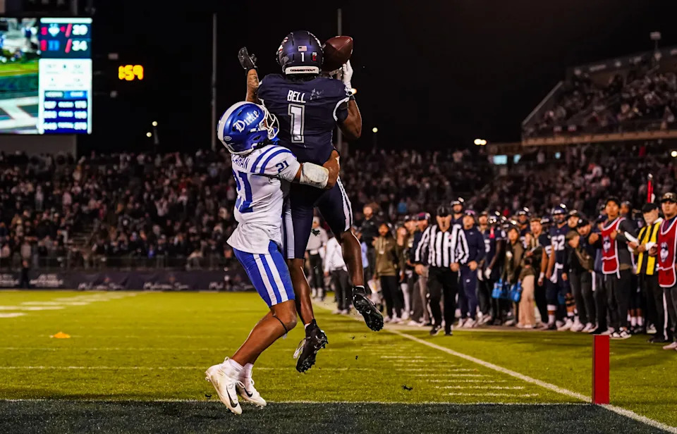 Nov 8, 2025; East Hartford, Connecticut, USA; UConn Huskies wide receiver Skyler Bell (1) makes the touchdown against Duke Blue Devils cornerback Landan Callahan (21) in the second half at Pratt & Whitney Stadium at Rentschler Field. Mandatory Credit: David Butler II-Imagn Images