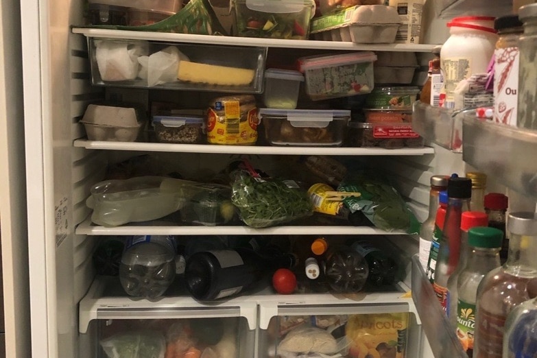 A very full share house fridge. 