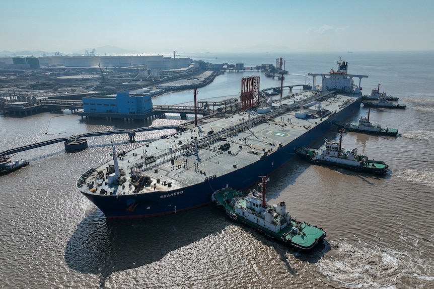 An aerial view shows a crude oil tanker at an oil terminal.