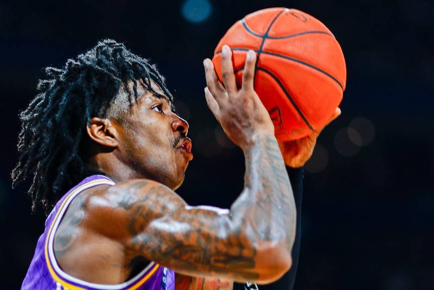 Kendric Davis shoots during the NBL championship series between the Sydney Kings and Adelaide 36ers.