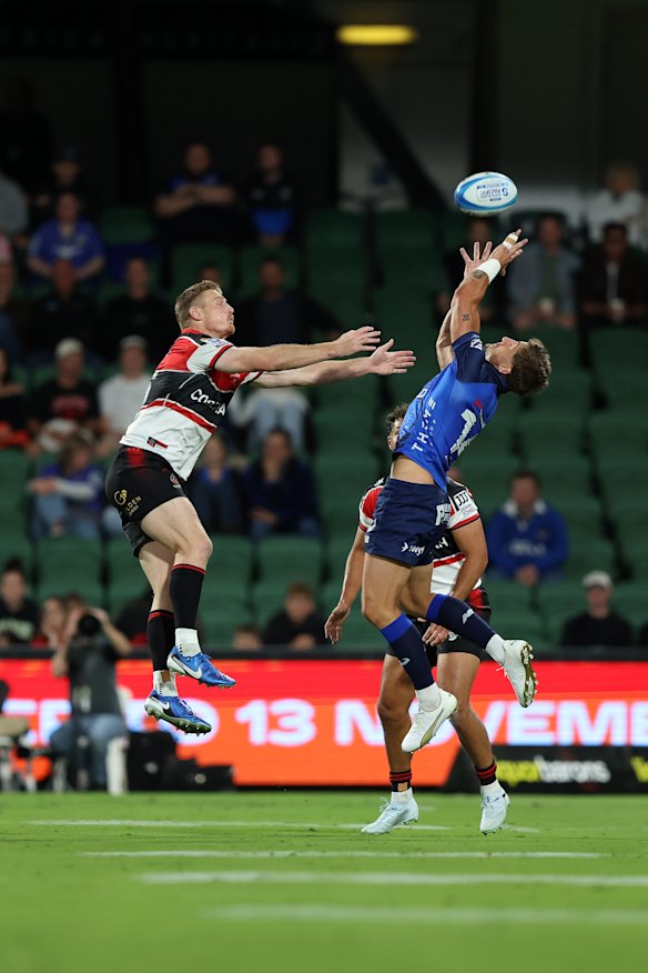 Zac Lomax soaring through the air to catch a ball for the Force.