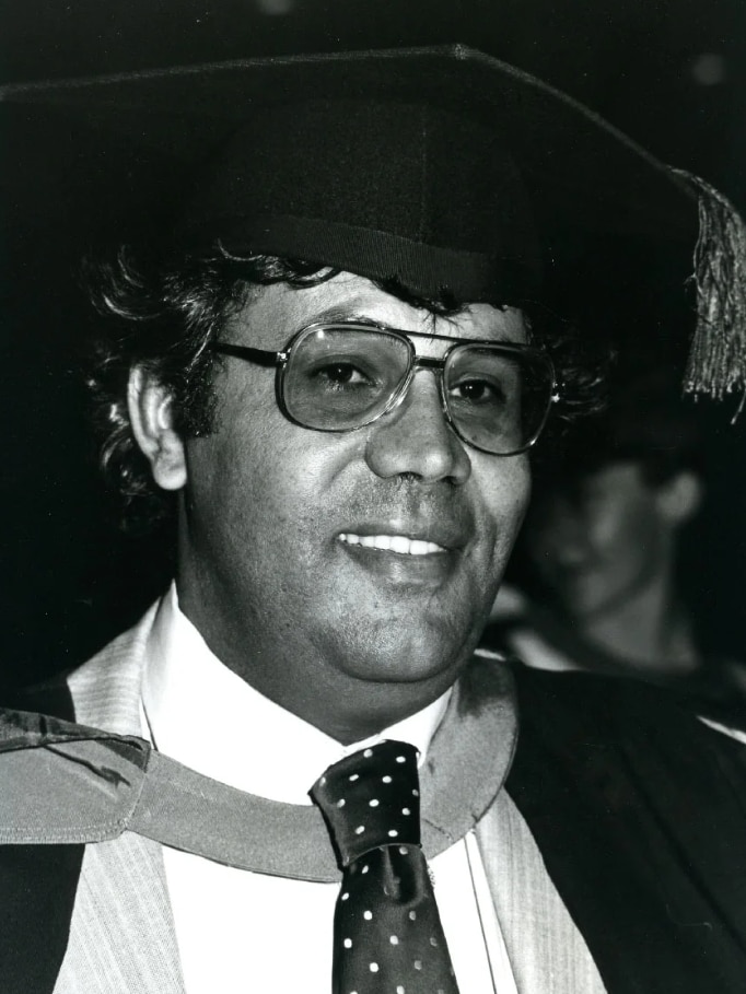 A man with a graduation cap.