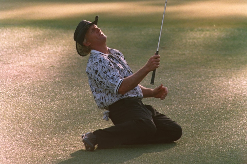 Greg Norman collapses after narrowly missing his chip shot on the 15th green during the final round of the 1996 US Masters