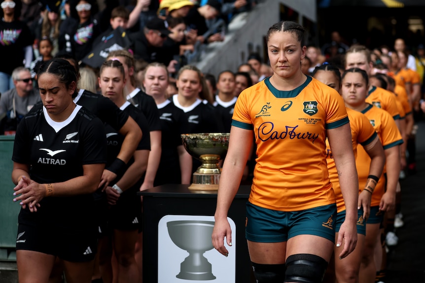 Michaela Leonard leads Wallaroos out against Black Ferns in 2024.