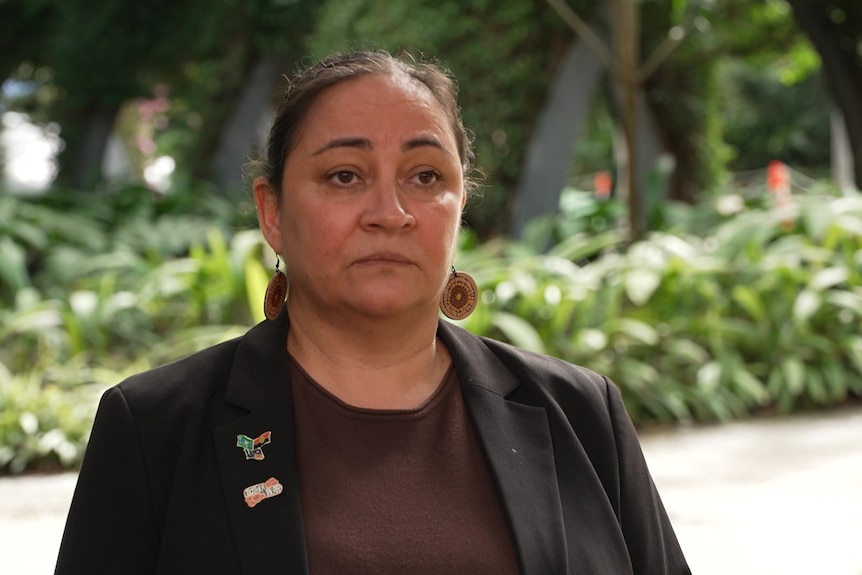 Katie Kiss with a neutral expression. 