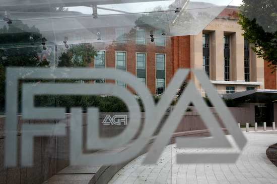 FILE - The U.S. Food and Drug Administration building is seen behind FDA logos at a bus stop on the agency's campus in Silver Spring, Md., Aug. 2, 2018. (AP Photo/Jacquelyn Martin, File) FILE - The U.S. Food and Drug Administration building is seen behind FDA logos at a bus stop on the agency's campus in Silver Spring, Md., Aug. 2, 2018. (AP Photo/Jacquelyn Martin, File)