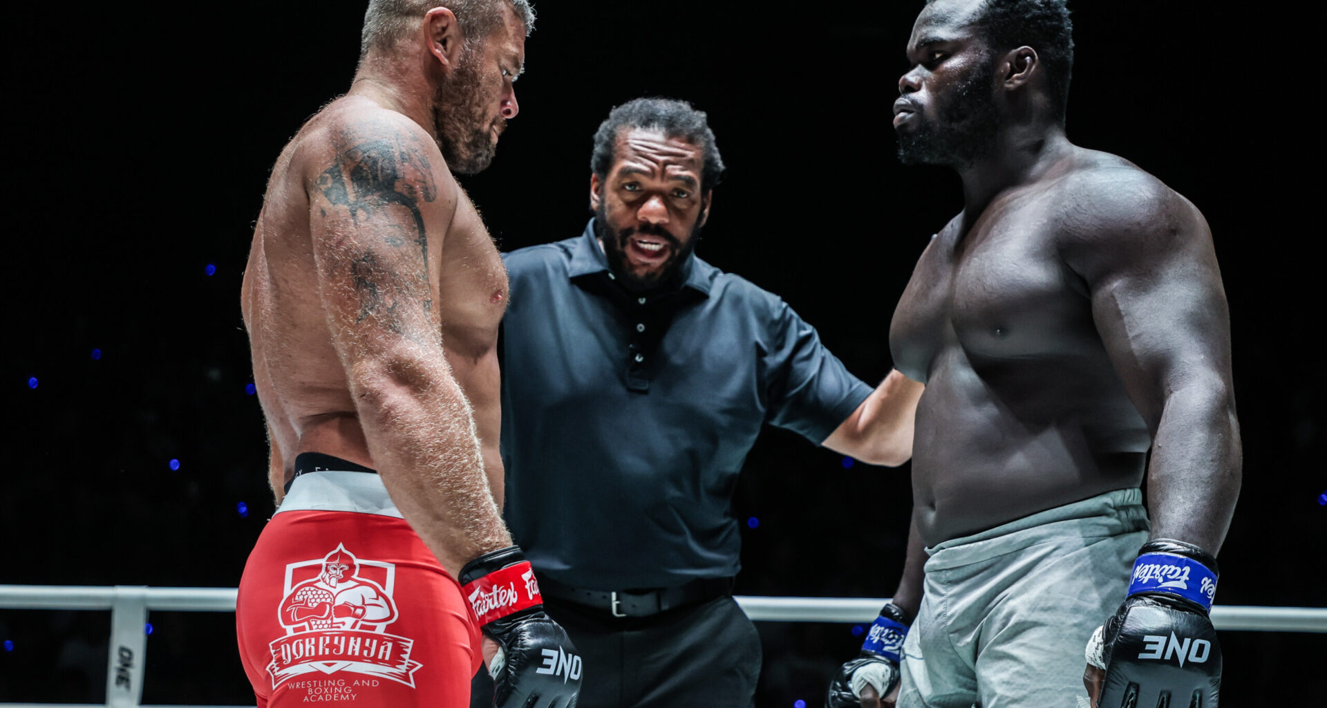 Anatoly Malykhin and "Reug Reug" Oumar Kane listen to Herb Dean before their MMA World Title fight