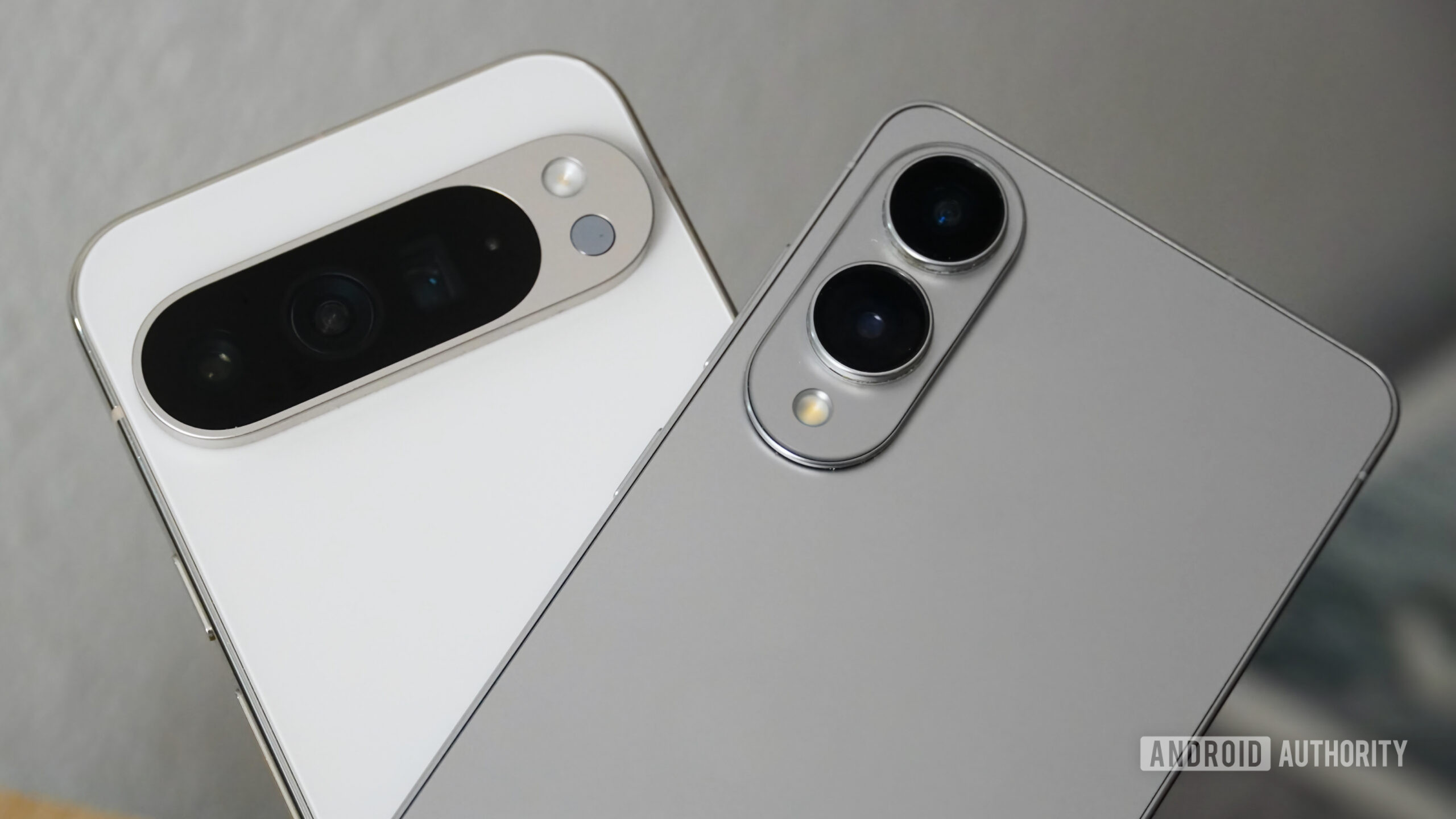 White and silver Pixel 9 Pro XL and Galaxy S25 Edge beside each other.