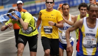 Lance Armstrong (C), who retired from cycling after winning an unprecedented seven straight Tour de France, crosses the finish line of the New York City Marathon in New York 04 November 2007. AFP PHOTO/TIMOTHY A. CLARY (Photo by TIMOTHY A. CLARY / AFP) (Photo by TIMOTHY A. CLARY/AFP via Getty Images)