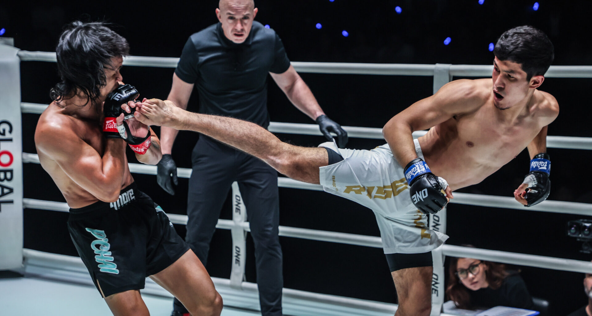 Uzbek MMA fighter Avazbek Kholmirzaev throws a spinning back kick at Jeremy Miado
