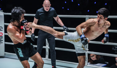 Uzbek MMA fighter Avazbek Kholmirzaev throws a spinning back kick at Jeremy Miado