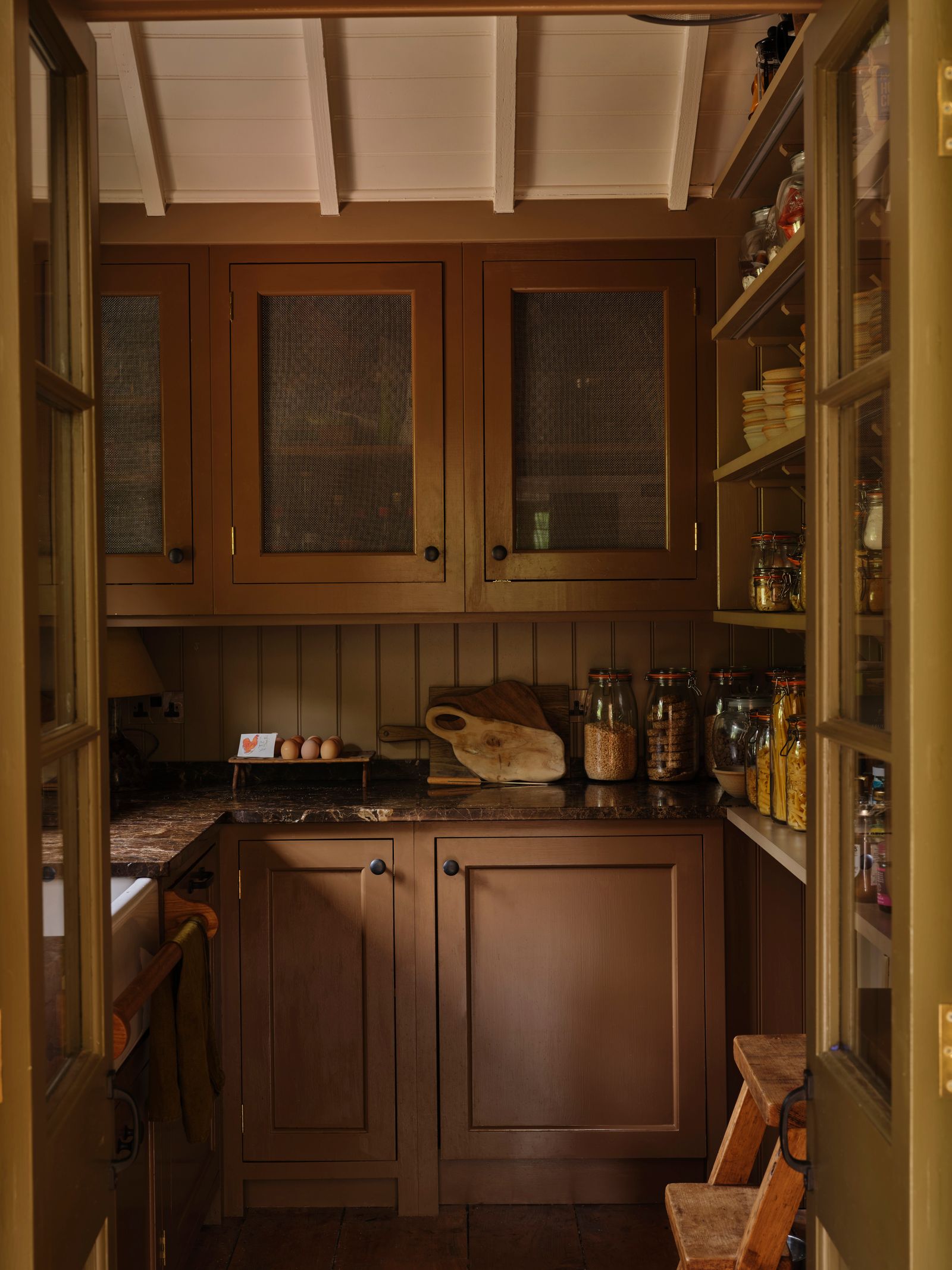 Image may contain Shelf Indoors Interior Design Pantry Closet Cupboard Furniture Cabinet Kitchen and Wood