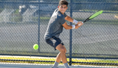 Tennis player getting ready to hit the ball.