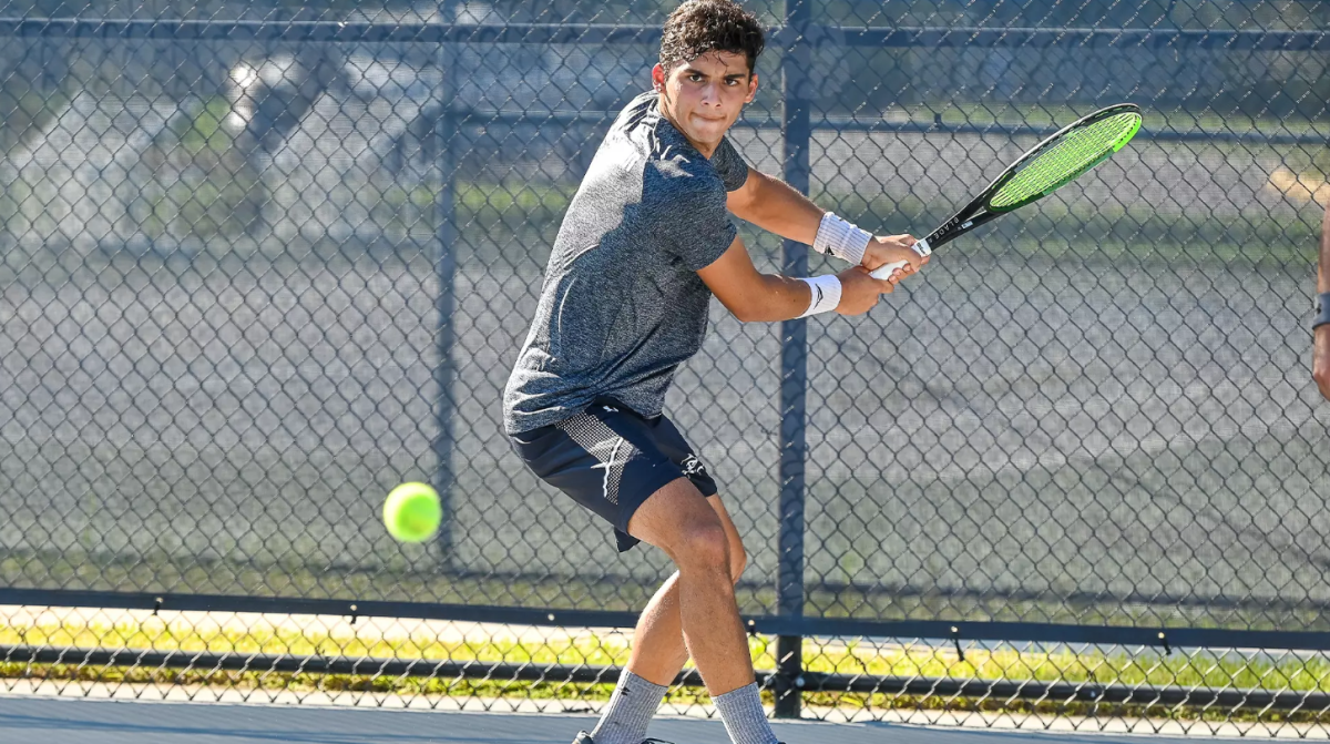 Tennis player getting ready to hit the ball.