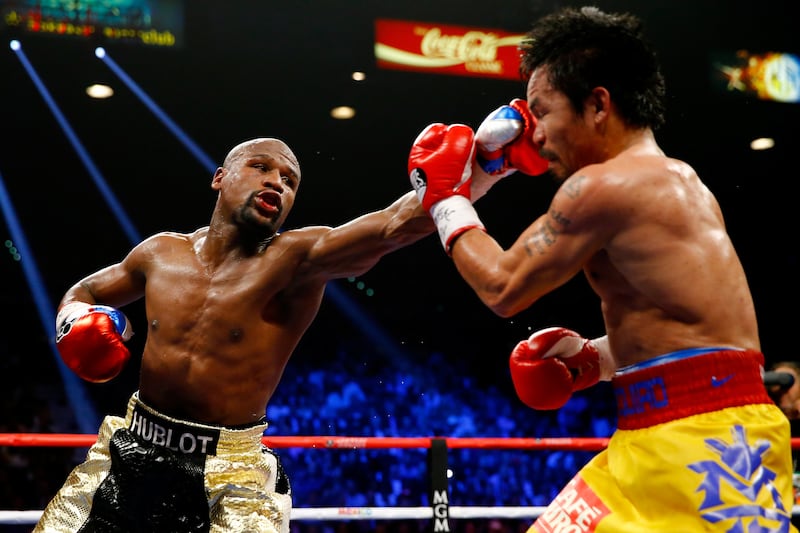 Floyd Mayweather throws a left at Manny Pacquiao during their welterweight unification world title bout at the MGM Grand Garden Arena in Las Vegas in 2015. Photograph: Al Bello/Getty Images