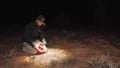 Ecologist releases a Bilby Credit: Australian Wildlife Conservancy
