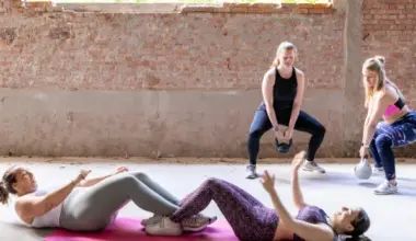 women in a gym lifting weights, another activity