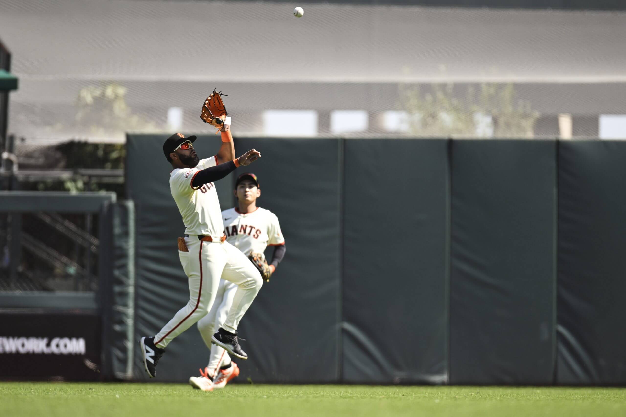 Heliot Ramos #17 of the San Francisco Giants catches a fly ball hit by the Colorado Rockies in the first inning at Oracle Park on September 27, 2025 in San Francisco, California.