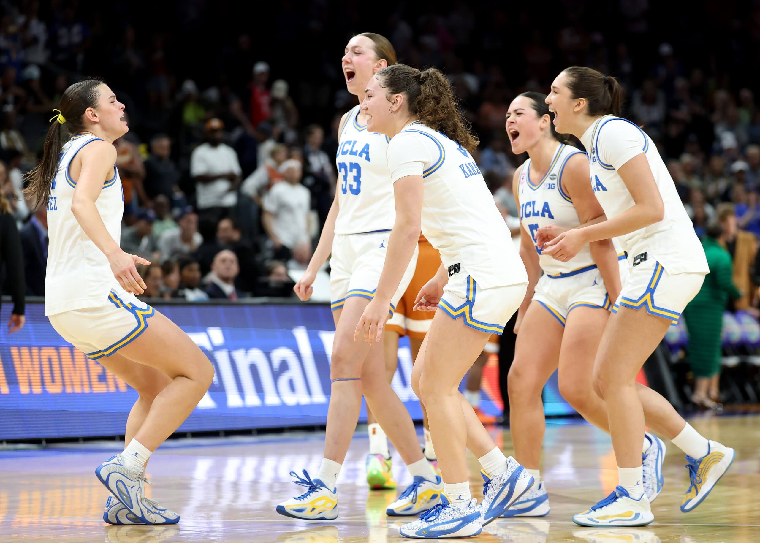 PHOENIX, ARIZONA - APRIL 03: Members of the UCLA Bruins celebrate after the victory against the Texas Longhorns in the Final Four of the NCAA Women's Basketball Tournament at Mortgage Matchup Center on April 03, 2026 in Phoenix, Arizona. (Photo by Christian Petersen/Getty Images)