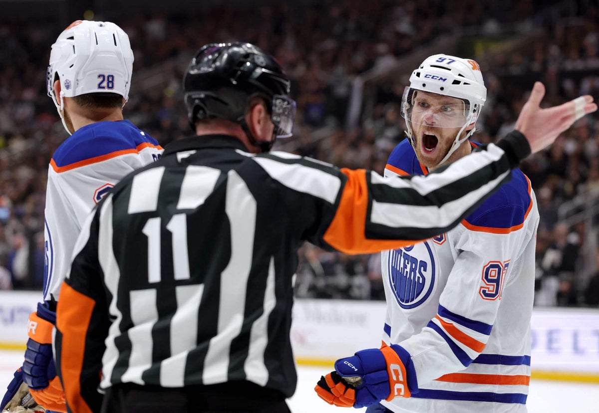 In the NHL playoffs, which calls are reviewable, and how are officials assigned?