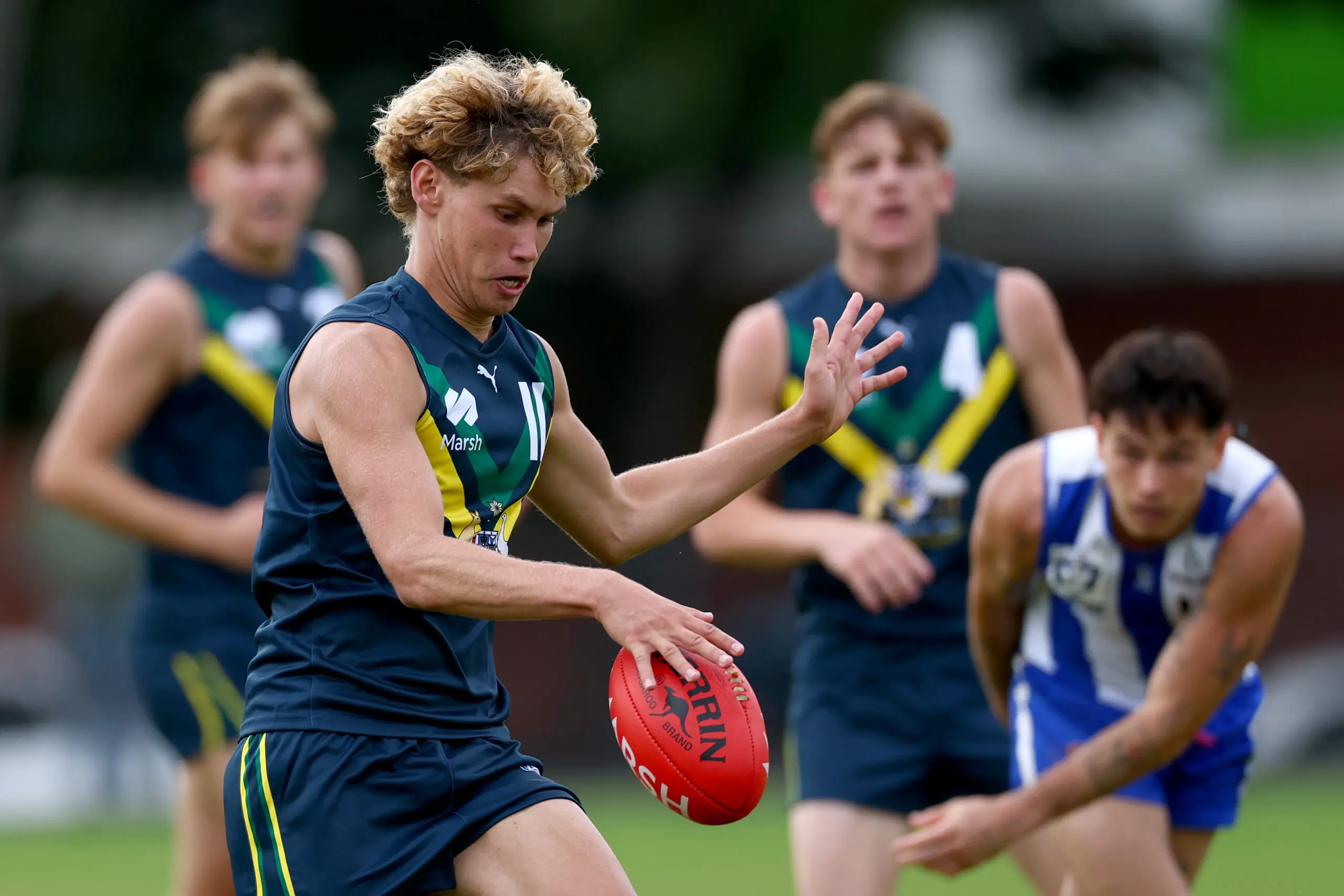 MELBOURNE, AUSTRALIA - APRIL 12: Caylen Murray of the AFL National Academy kicks during the Marsh AFL National Academy Boys match between Australia U18 and North Melbourne VFL at Arden Street Ground on April 12, 2026 in Melbourne, Australia. (Photo by Josh Chadwick/AFL Photos/via Getty Images)