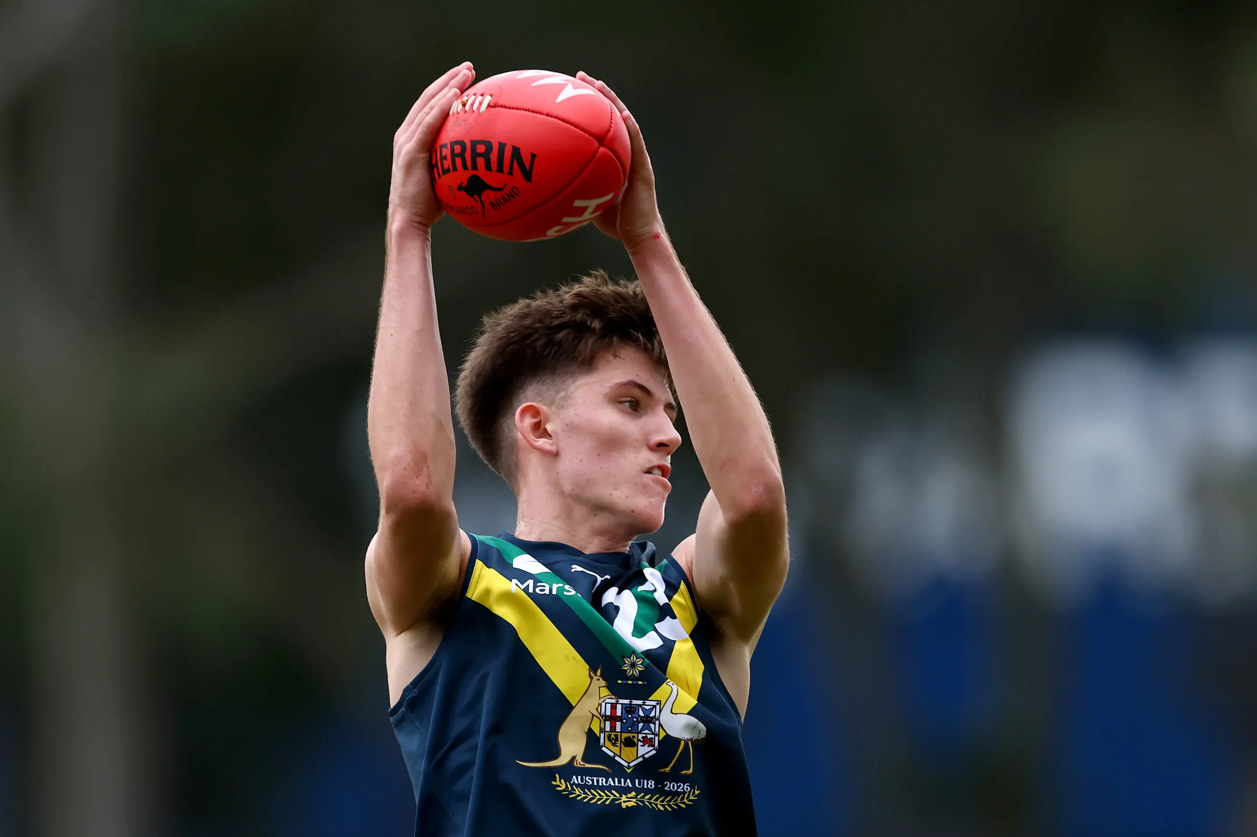MELBOURNE, AUSTRALIA - APRIL 12: Ethan Matthews of the AFL National Academy marks during the Marsh AFL National Academy Boys match between Australia U18 and North Melbourne VFL at Arden Street Ground on April 12, 2026 in Melbourne, Australia. (Photo by Josh Chadwick/AFL Photos/via Getty Images)