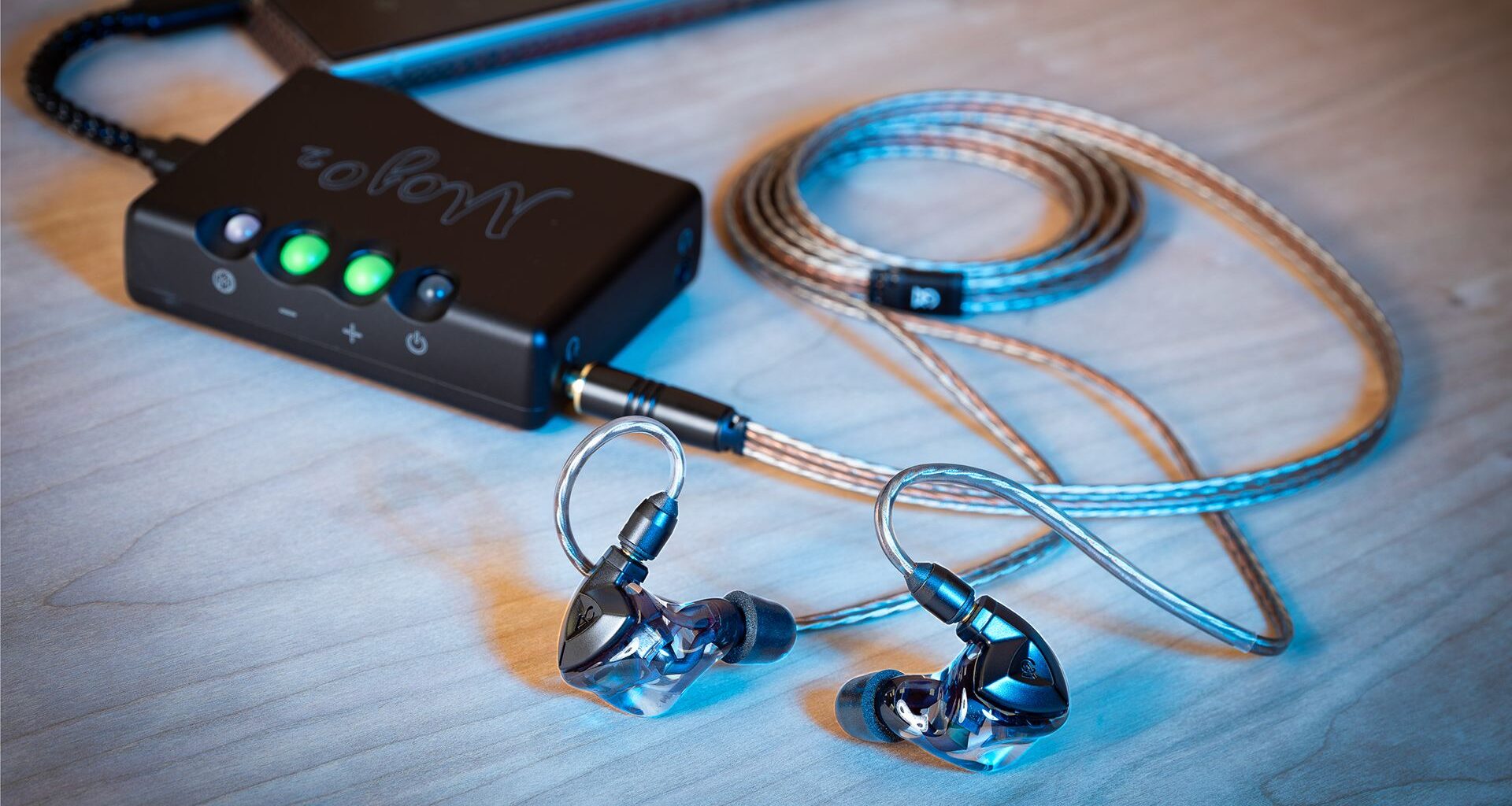 A photo of some wired IEMs, connected to a desktop DAC/Amp.