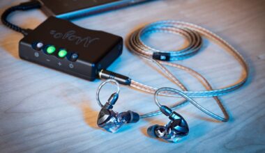 A photo of some wired IEMs, connected to a desktop DAC/Amp.