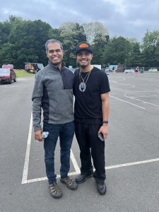 Two men smiling at the camera