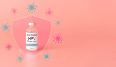 Human papillomavirus (HPV) vaccine bottle with glass shield and virus on pink background. HPV vaccine protects against certain types of HPV that can cause cervical cancer.