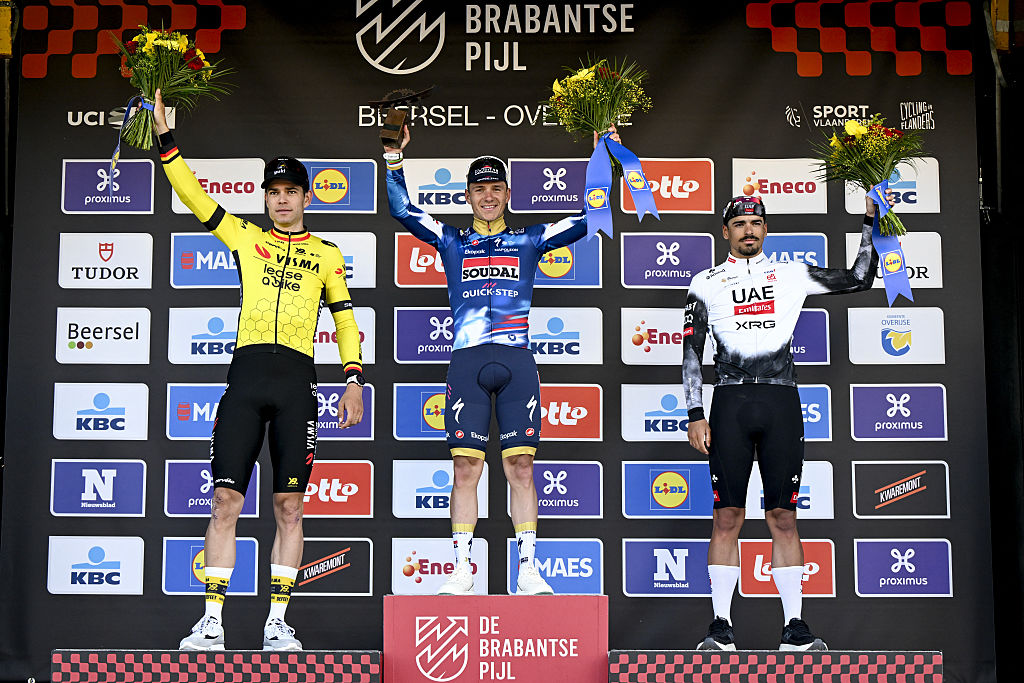 Wout van Aert of Team Visma-Lease a Bike, Remco Evenepoel of Soudal Quick-Step, third placed Portuguese Antonio Morgado of UAE Team Emirates celebrate on the podium after the men's 'Brabantse Pijl'