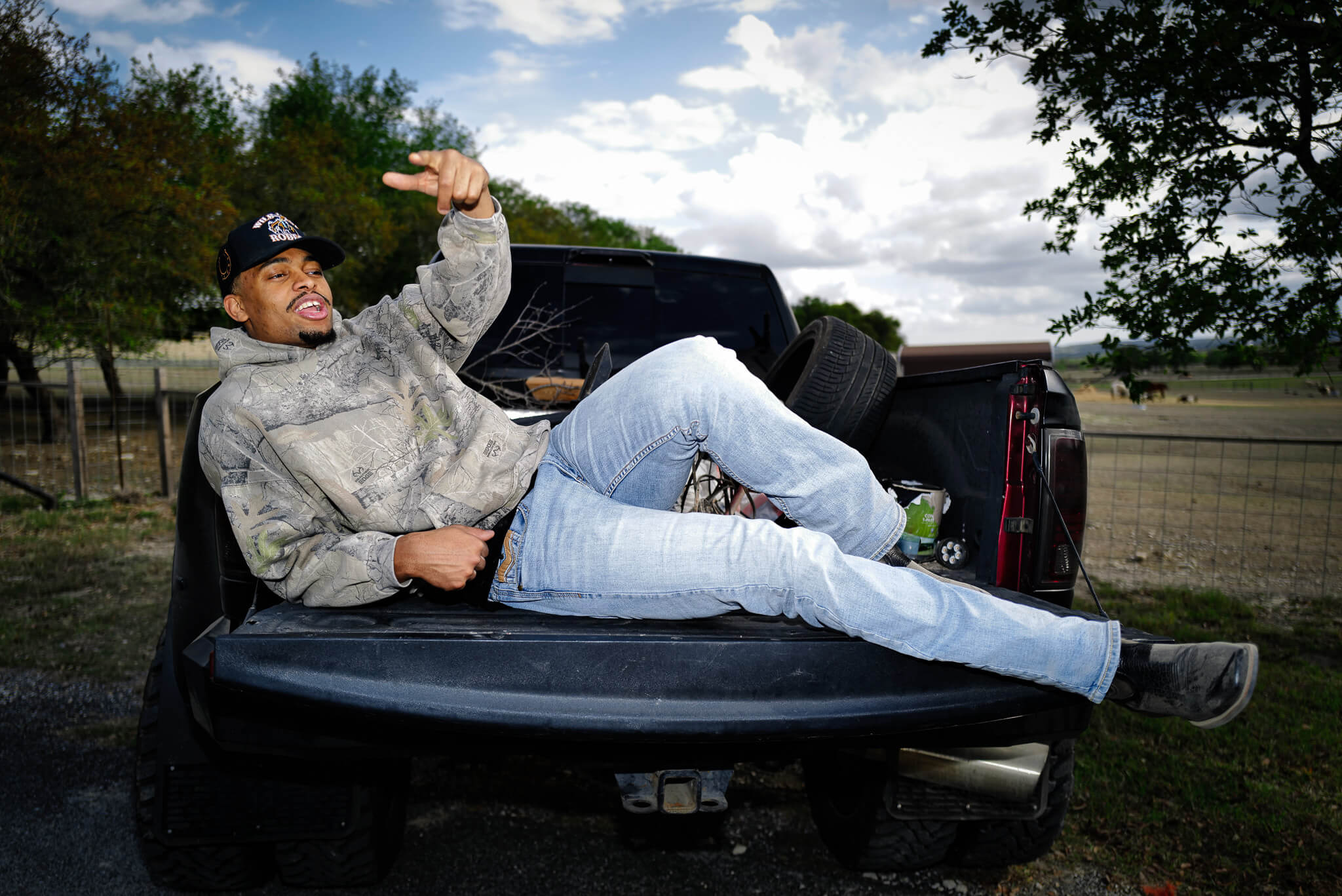 Keldon Johnson sits in a pickup truck on his ranch.