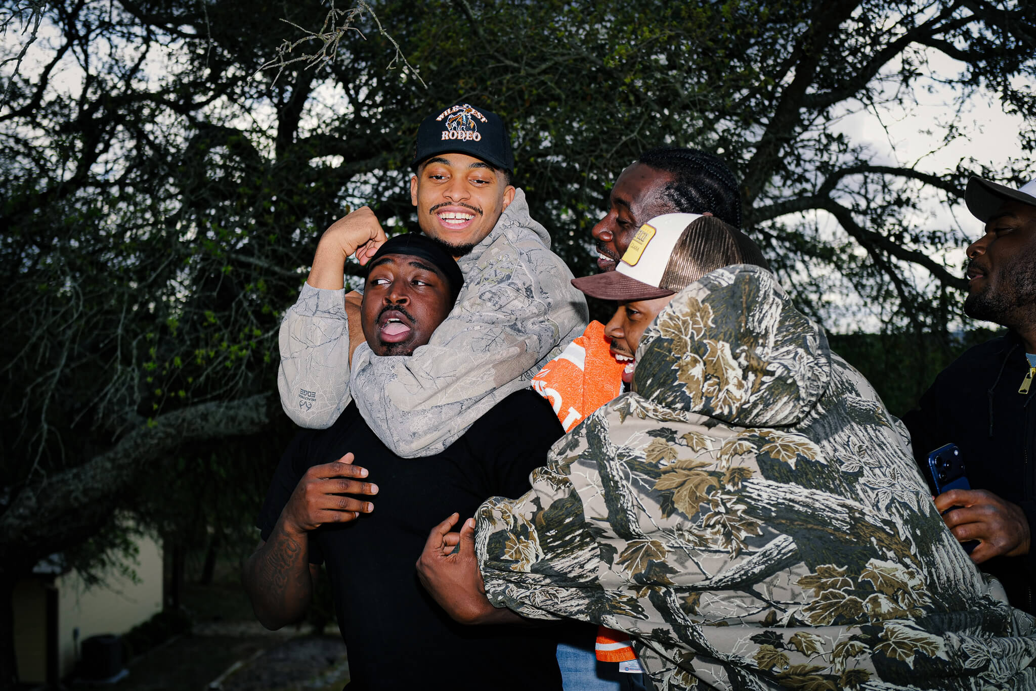 Keldon Johnson wrestles with his friends and family on his ranch.