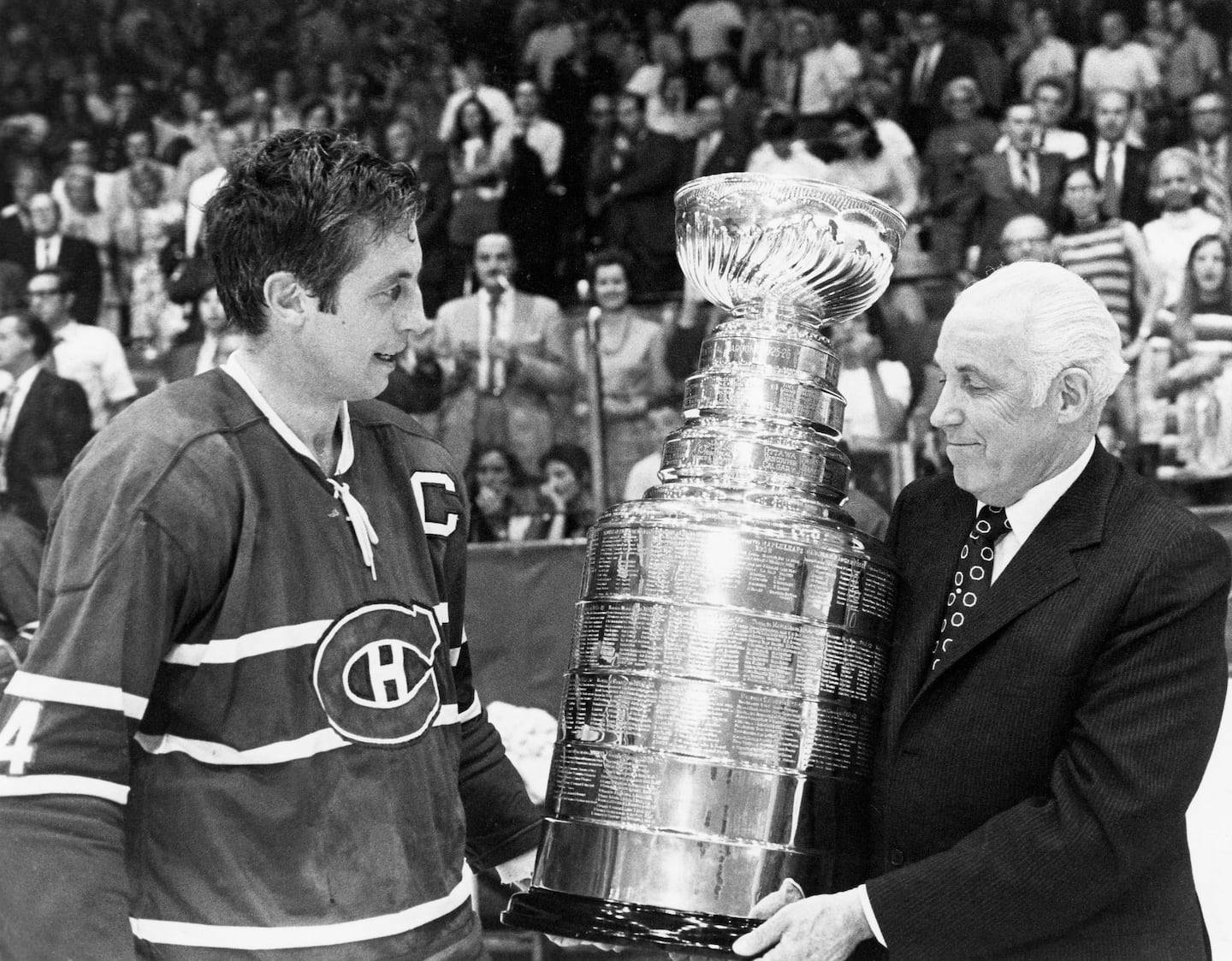 The Gentleman of the Forum, legendary Canadiens captain Jean Beliveau, accepts his 10th and final Stanley Cup from NHL commissioner Clarence Campbell after beating Chicago in seven games in 1971. 