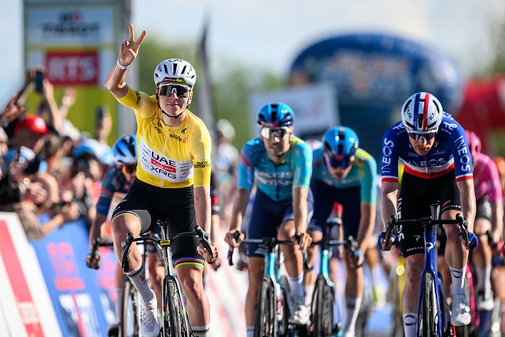 Pogacar holds up two fingers as he wins the stage