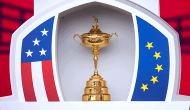 The Ryder Cup sits in between an American flag pattern (left) and a European flag pattern (right)